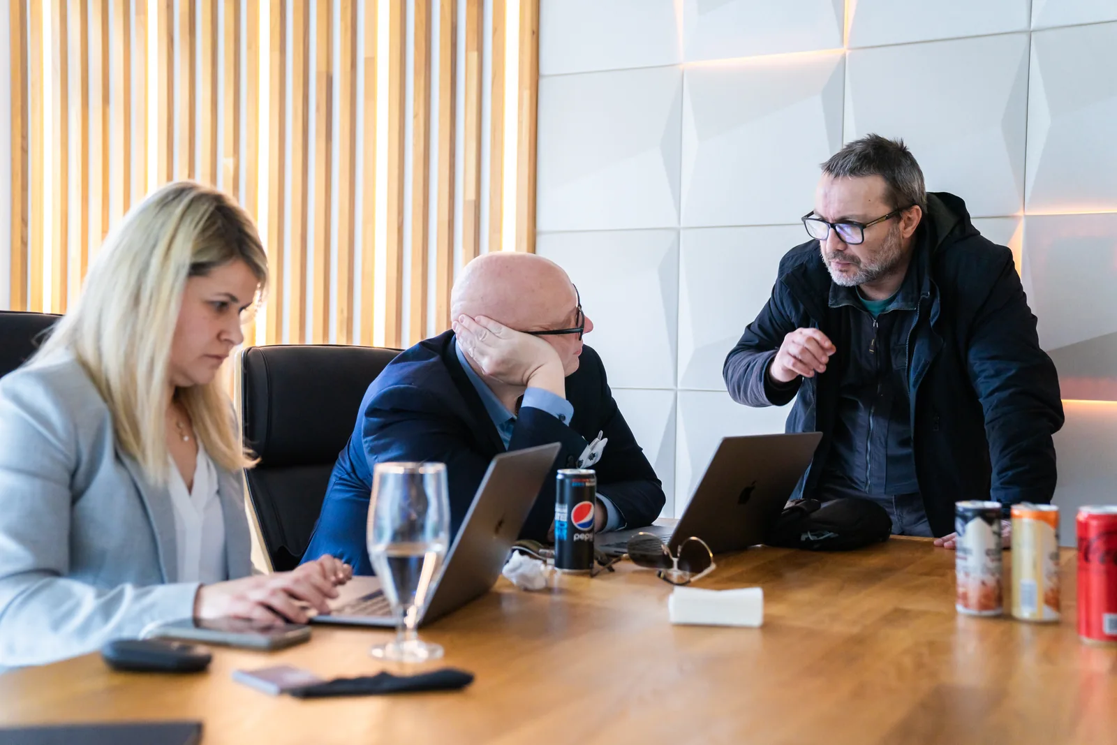 Workshop participants discuss a question around their laptops.