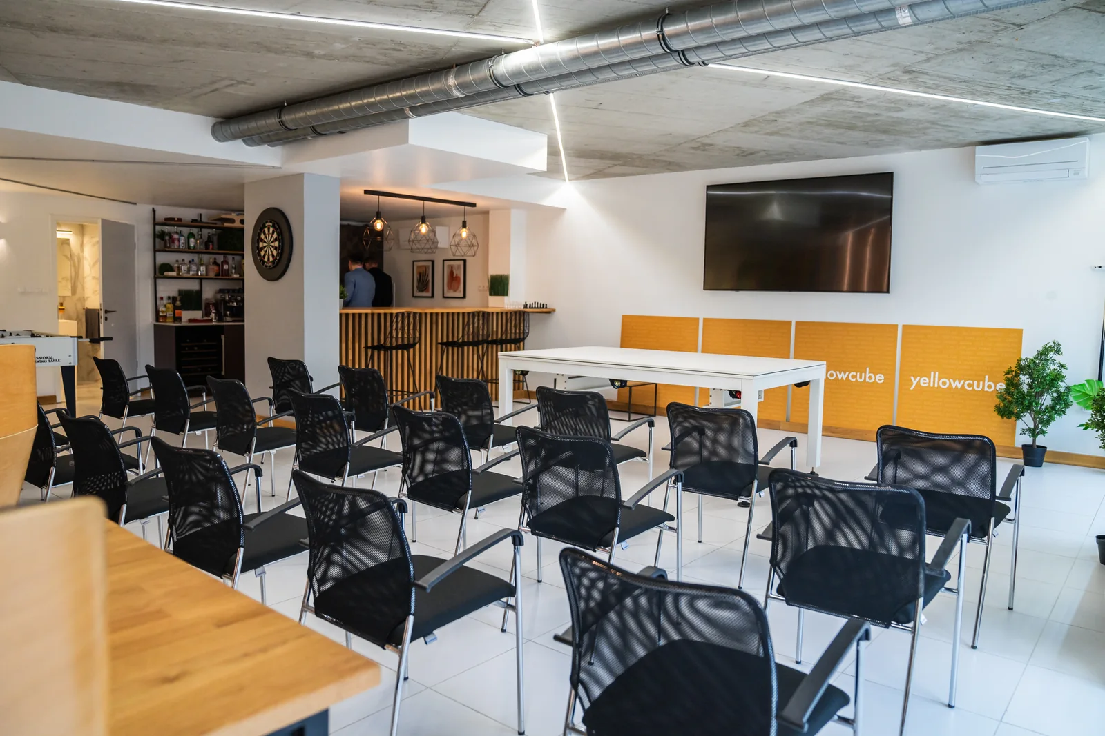 Chairs and presentation equipment in the Yellow Cube training space.